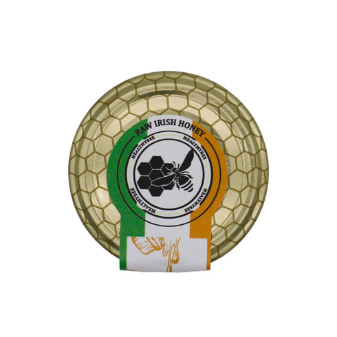 Honey jar with a honeycomb design and a visible brand logo on a white background | Healthy Bee Ireland