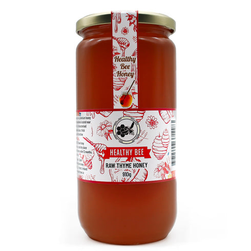 Jar of Healthy Bee Raw Thyme Honey on a white background